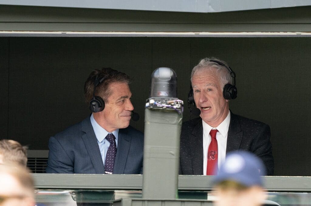 Jul 3, 2023; London, United Kingdom; John McEnroe and Chris Fowler in the ESPN booth on Centre Court during the Novak Djokovic (SRB) and Pedro Cachin (ARG) match at the All England Lawn Tennis and Croquet Club. Mandatory Credit: Susan Mullane-USA TODAY Sports