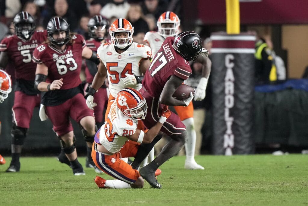 Nov 25, 2023; Columbia, South Carolina, USA; South Carolina Gamecocks wide receiver Xavier Legette (17) is tackled by Clemson Tigers cornerback Avieon Terrell (20) in the second half at Williams-Brice Stadium. Mandatory Credit: David Yeazell-Imagn Images