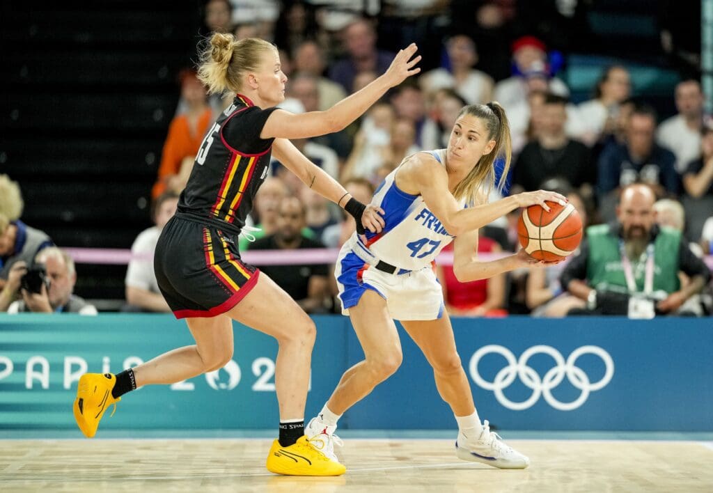 Aug 9, 2024; Paris, France; France point guard Romane Bernies (47) looks to pass around Belgium power forward Nastja Claessens (15) in a women's basketball semifinal game during the Paris 2024 Olympic Summer Games at Accor Arena. Mandatory Credit: Kyle Terada-USA TODAY Sports