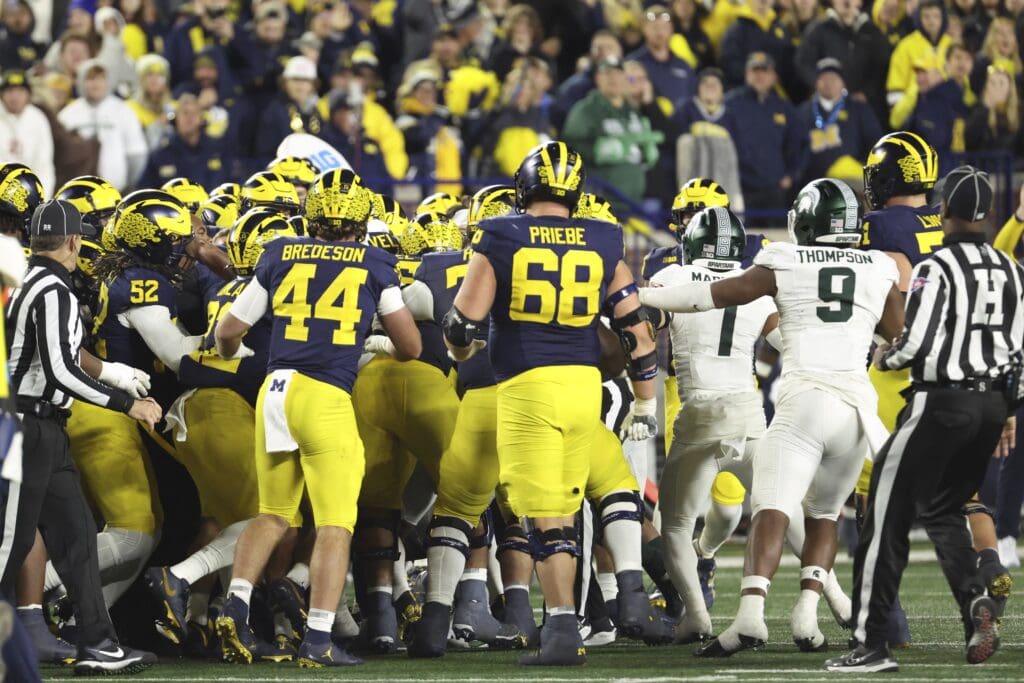 Oct 26, 2024; Ann Arbor, Michigan, USA; Michigan Wolverines and Michigan State Spartans players fight after the game at Michigan Stadium. Mandatory Credit: Rick Osentoski-Imagn Images