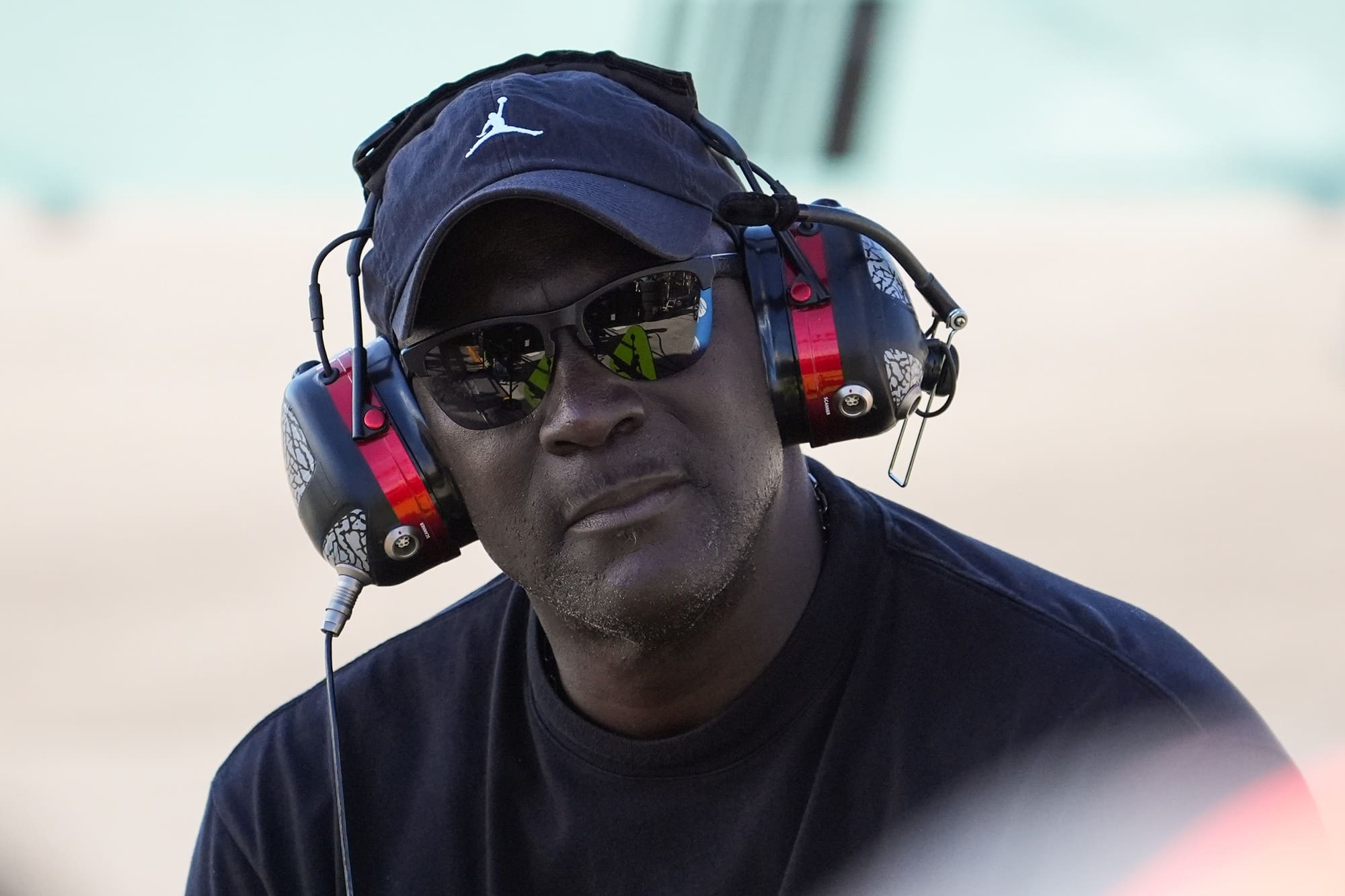 Oct 27, 2024; Homestead, Florida, USA; 23XI team owner Michael Jordan watches during the Straight Talk Wireless 400 at Homestead-Miami Speedway. Mandatory Credit: Jasen Vinlove-Imagn Images
