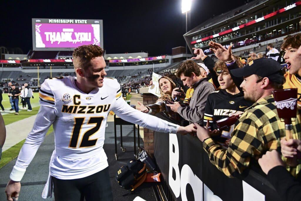 Nov 23, 2024; Starkville, Mississippi, USA; Missouri Tigers quarterback Brady Cook (12) reacts with fans after a game against the Mississippi State Bulldogs at Davis Wade Stadium at Scott Field.