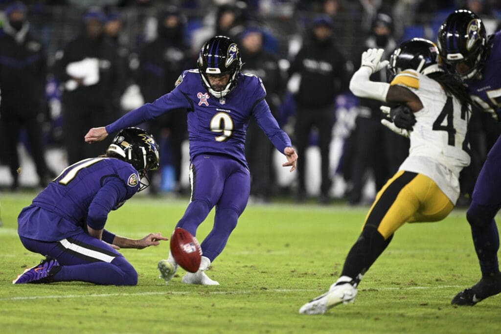Dec 21, 2024; Baltimore, Maryland, USA; Baltimore Ravens place kicker Justin Tucker (9) kicks a 50-yard field goal during the first half against the Pittsburgh Steelers at M&T Bank Stadium. Mandatory Credit: Tommy Gilligan-Imagn Images
