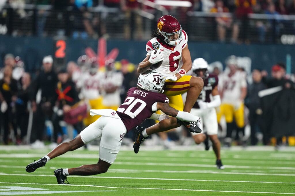 Dec 27, 2024; Las Vegas, NV, USA; Southern California Trojans wide receiver Makai Lemon (6) carries the ball against Texas A&M Aggies defensive back BJ Mayes (20) in the second half at Allegiant Stadium. Mandatory Credit: Kirby Lee-Imagn Images