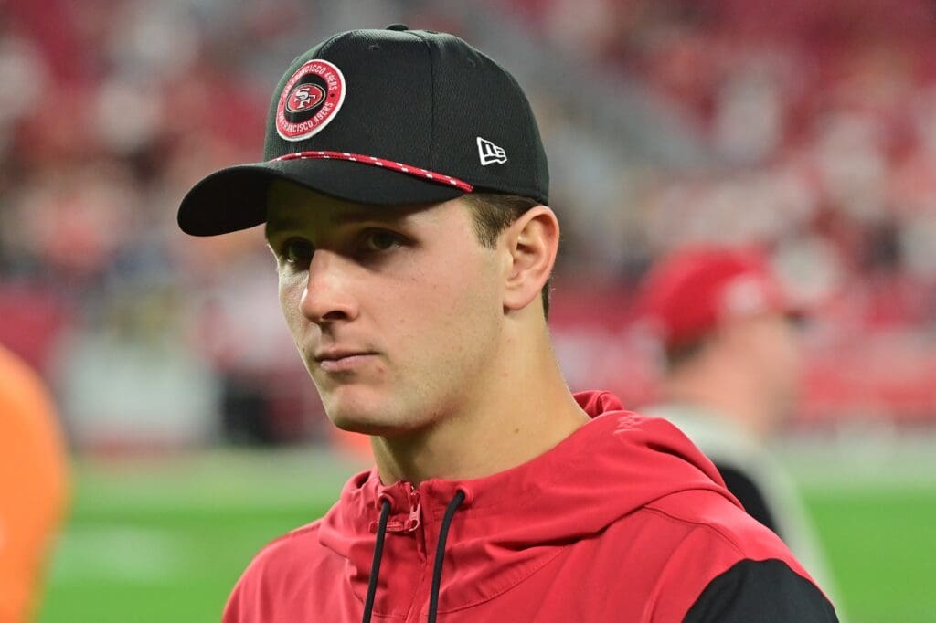 Jan 5, 2025; Glendale, Arizona, USA; San Francisco 49ers quarterback Brock Purdy (13) looks on after losing to the Arizona Cardinals at State Farm Stadium. Mandatory Credit: Matt Kartozian-Imagn Images