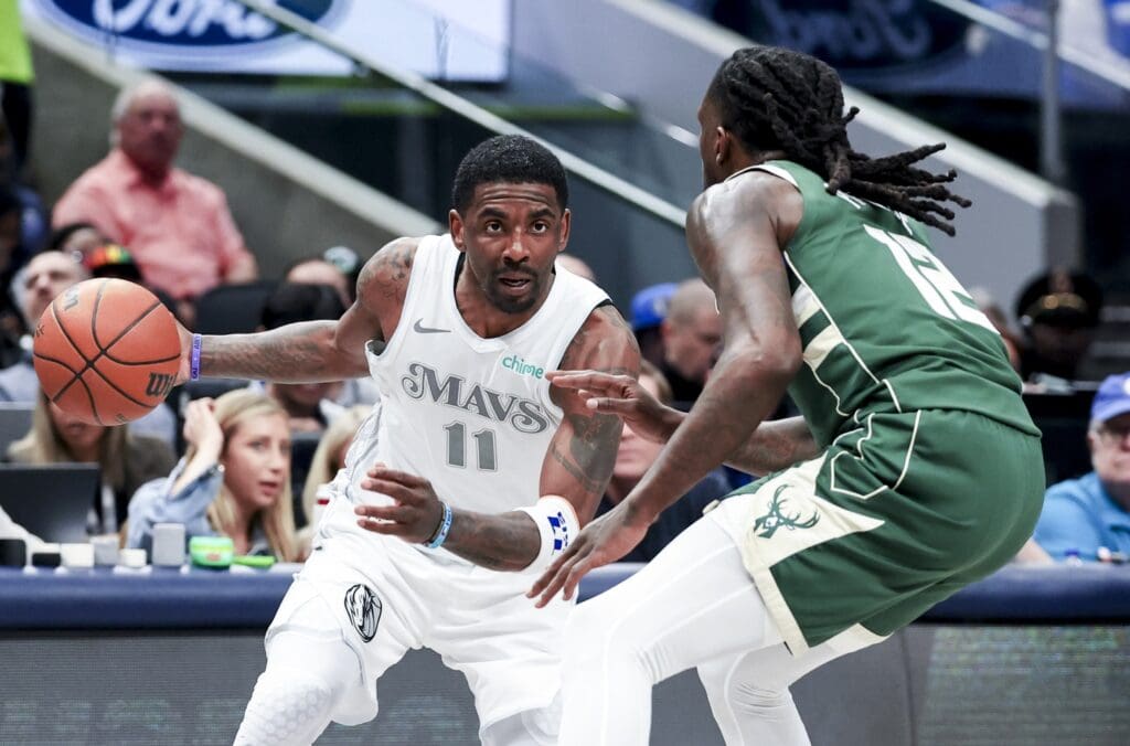 Mar 1, 2025; Dallas, Texas, USA; Dallas Mavericks guard Kyrie Irving (11) drives to the basket as Milwaukee Bucks forward Taurean Prince (12) defends during the first half at American Airlines Center. Mandatory Credit: Kevin Jairaj-Imagn Images