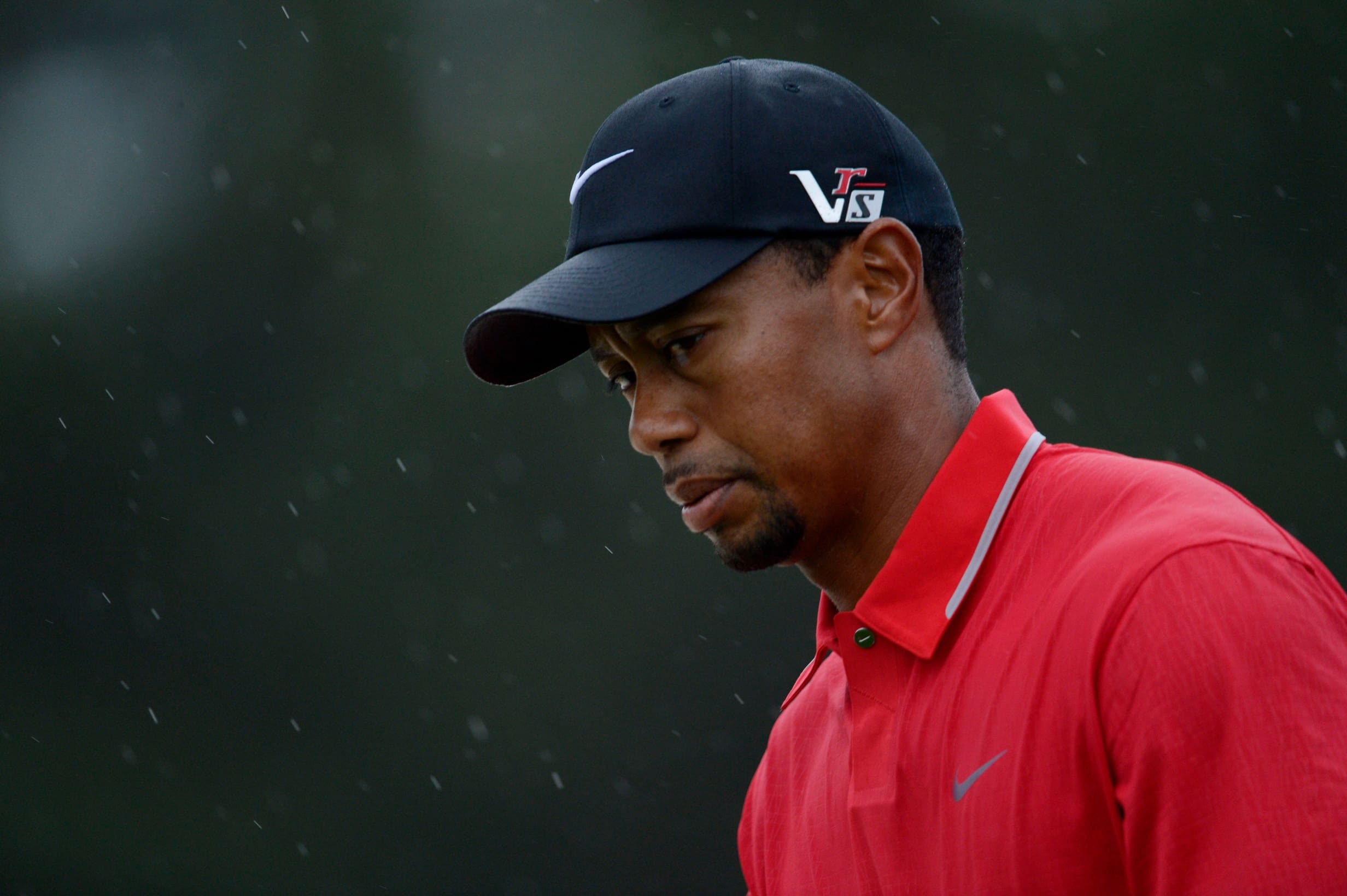 Tiger Woods walks to the 18th green during the final round of the 2013 The Masters golf tournament at Augusta National Golf Club.