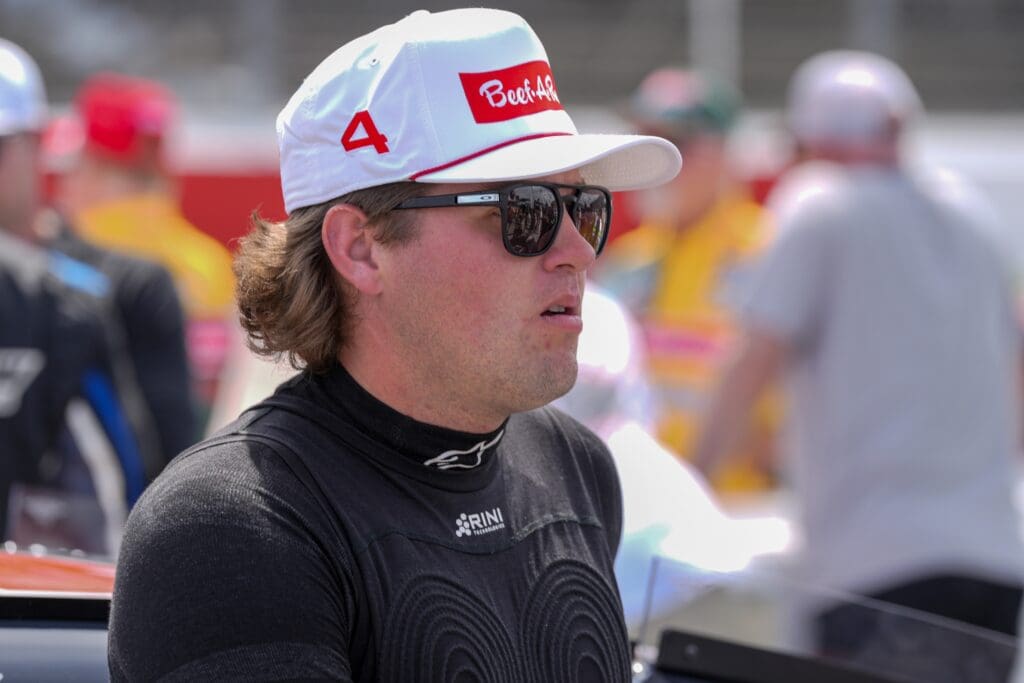 Apr 6, 2025; Darlington, South Carolina, USA; NASCAR Cup Series driver Noah Gragson (4) pre race during the Goodyear 400 at Darlington Raceway. Mandatory Credit: Jim Dedmon-Imagn Images