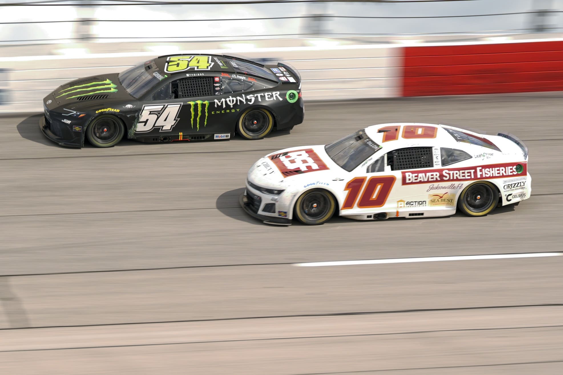 Apr 6, 2025; Darlington, South Carolina, USA; NASCAR Cup Series driver Ty Gibbs (54) and driver Ty Dillon (10) during the Goodyear 400 at Darlington Raceway. Mandatory Credit: Jim Dedmon-Imagn Images