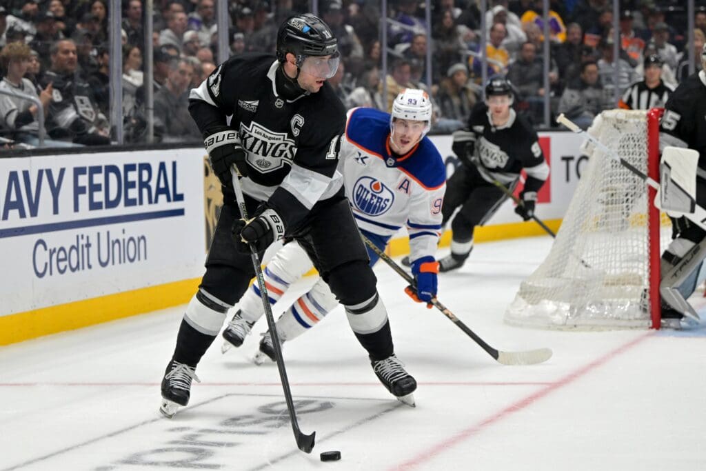 Apr 23, 2025; Los Angeles, California, USA; Los Angeles Kings center Anze Kopitar (11) handles the puck in the third period of game 2 of the 2025 Stanley Cup Playoffs against the Edmonton Oilers at Crypto.com Arena. Mandatory Credit: Jayne Kamin-Oncea-Imagn Images