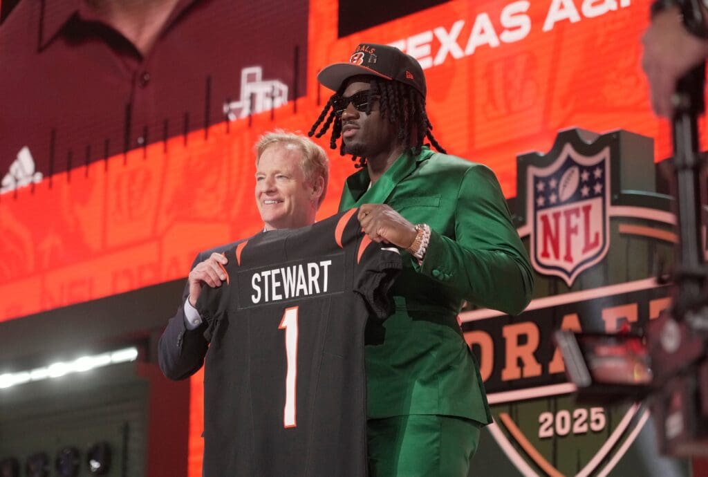 Texas A&M Aggies defensive end Shemar Stewart poses with NFL commissioner Roger Goodell poses after being selected by the Cincinnati Bengals as the number seventeen pick in the first round of the 2025 NFL Draft at Lambeau Field.