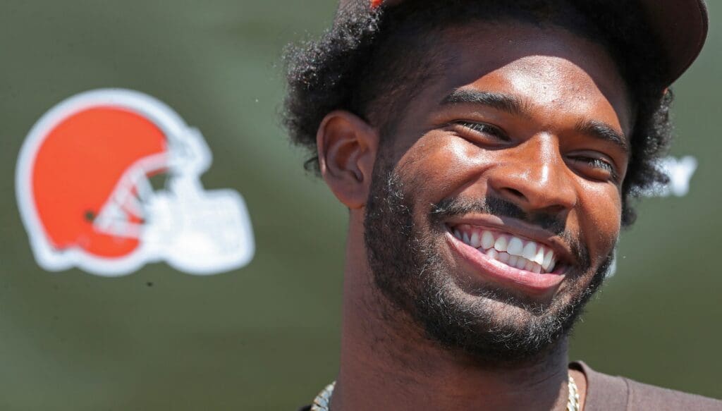 Cleveland Browns quarterback Shedeur Sanders (12) is all smiles as he reflects on his first day of practice during a press conference before day two of NFL rookie minicamp at the Cleveland Browns training facility on Saturday, May 10, 2025, in Berea, Ohio.