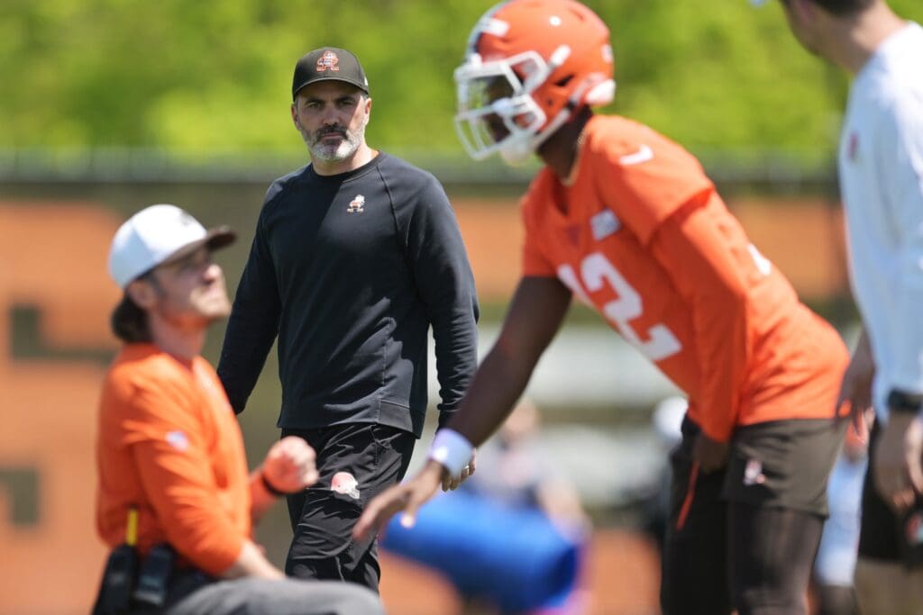 May 10, 2025; Berea, OH, USA; Cleveland Browns head coach Kevin Stefanski watches quarterback Shedeur Sanders (12) during rookie minicamp at CrossCountry Mortgage Campus. Mandatory Credit: Ken Blaze-Imagn Images
