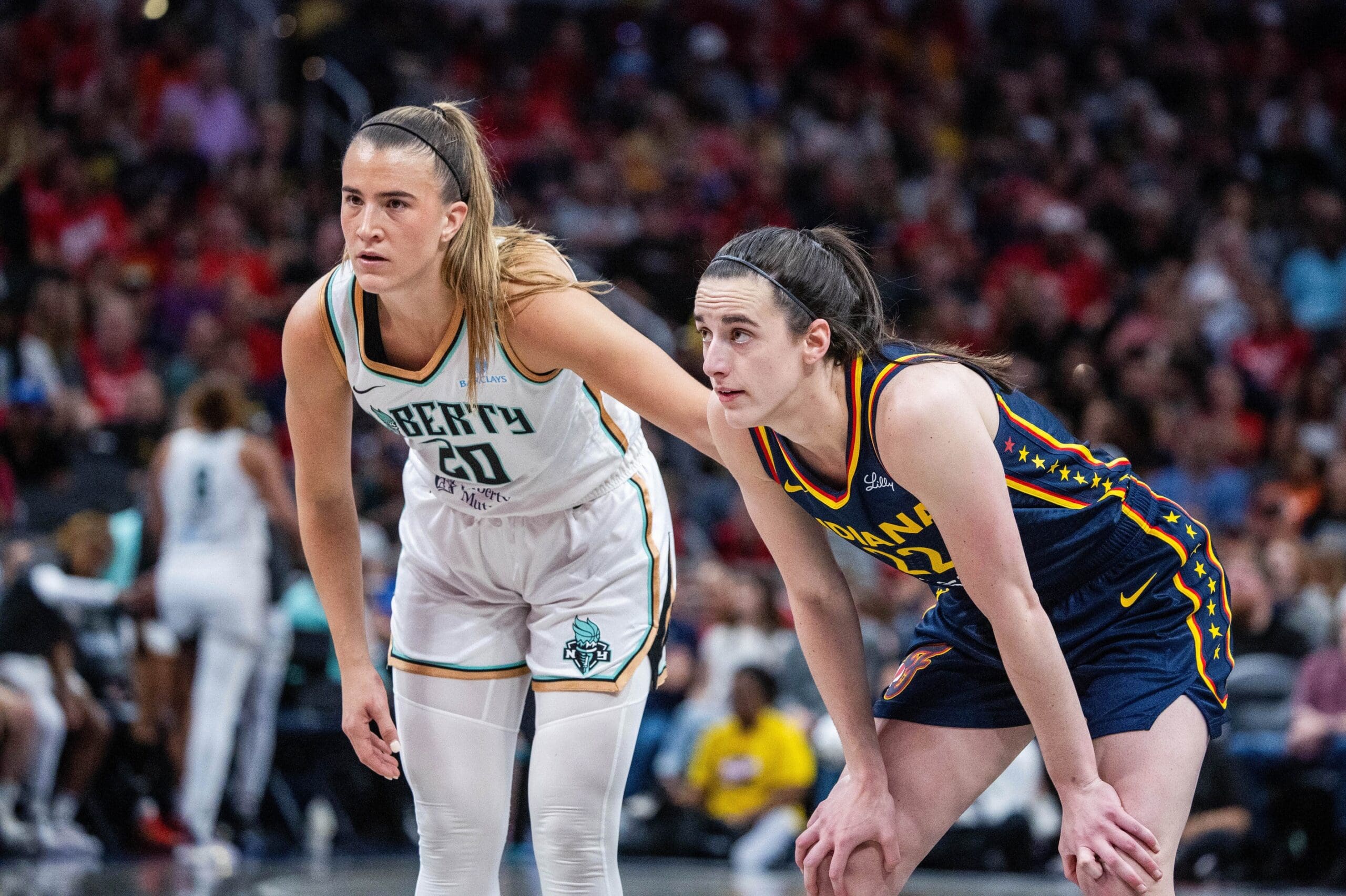 Jun 14, 2025; Indianapolis, Indiana, USA; New York Liberty guard Sabrina Ionescu (20) and Indiana Fever guard Caitlin Clark (22) in the second half at Gainbridge Fieldhouse. Mandatory Credit: Trevor Ruszkowski-Imagn Images