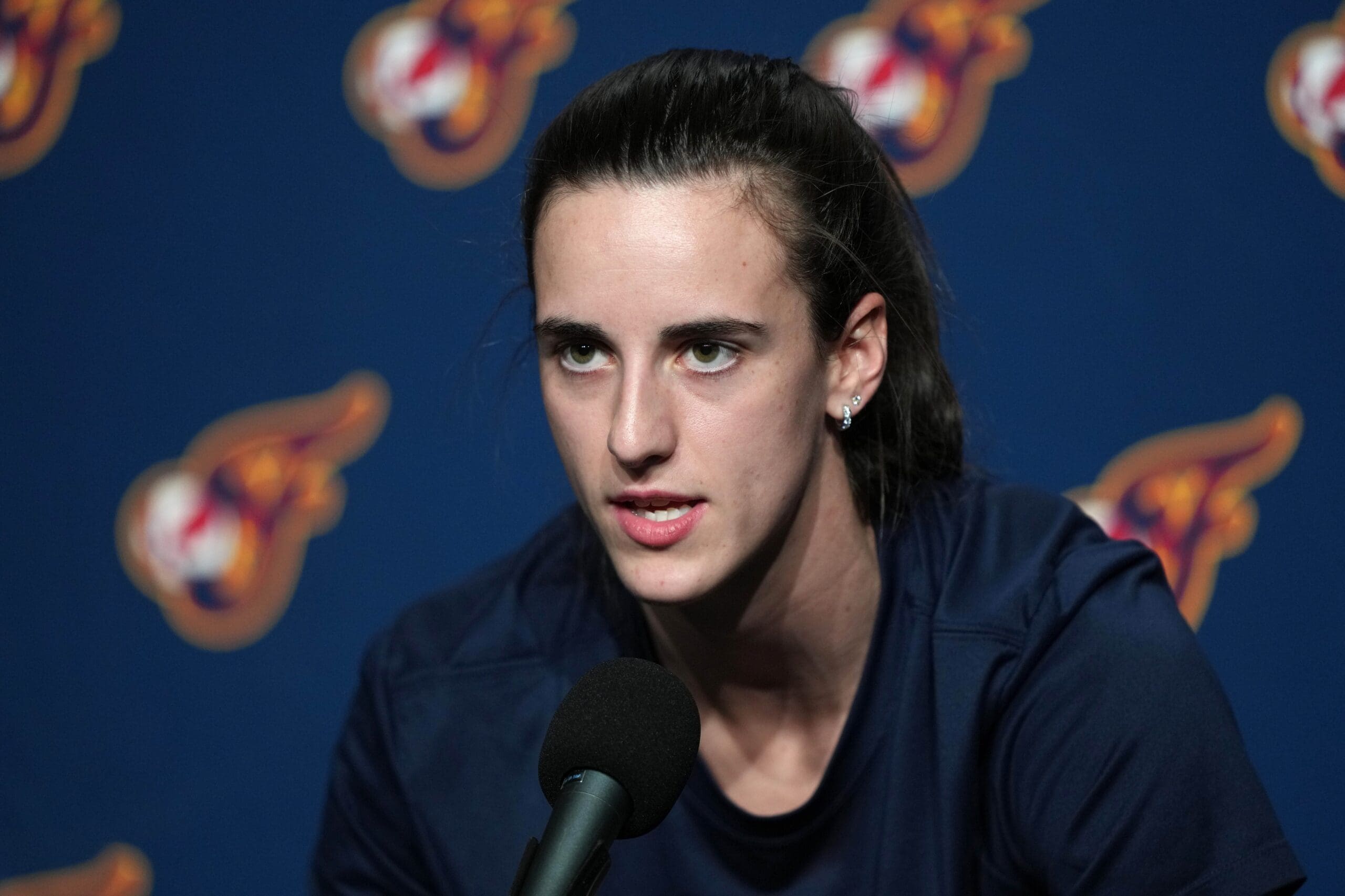 Jun 19, 2025; San Francisco, California, USA; Indiana Fever guard Caitlin Clark (22) talks to media members before the game against the Golden State Valkyries at Chase Center. Mandatory Credit: Darren Yamashita-Imagn Images