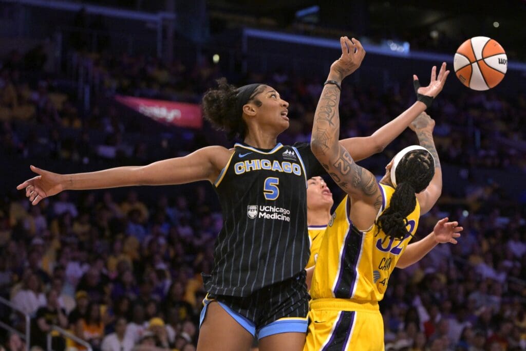 Jun 29, 2025; Los Angeles, California, USA; Chicago Sky forward Angel Reese (5) and Los Angeles Sparks forward Emma Cannon (32) go for a rebound in the second half at Crypto.com Arena. Mandatory Credit: Jayne Kamin-Oncea-Imagn Images