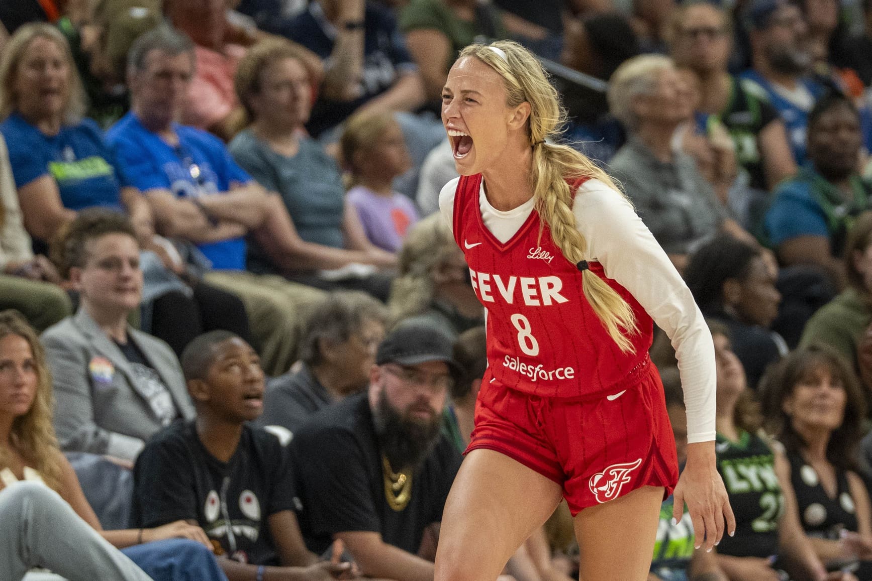 Jul 1, 2025; Minneapolis, Minnesota, USA; Indiana Fever guard Sophie Cunningham (8) celebrates after making a three point shot against the Minnesota Lynx in the second half during the Commissioner's Cup final at Target Center. Mandatory Credit: Jesse Johnson-Imagn Images