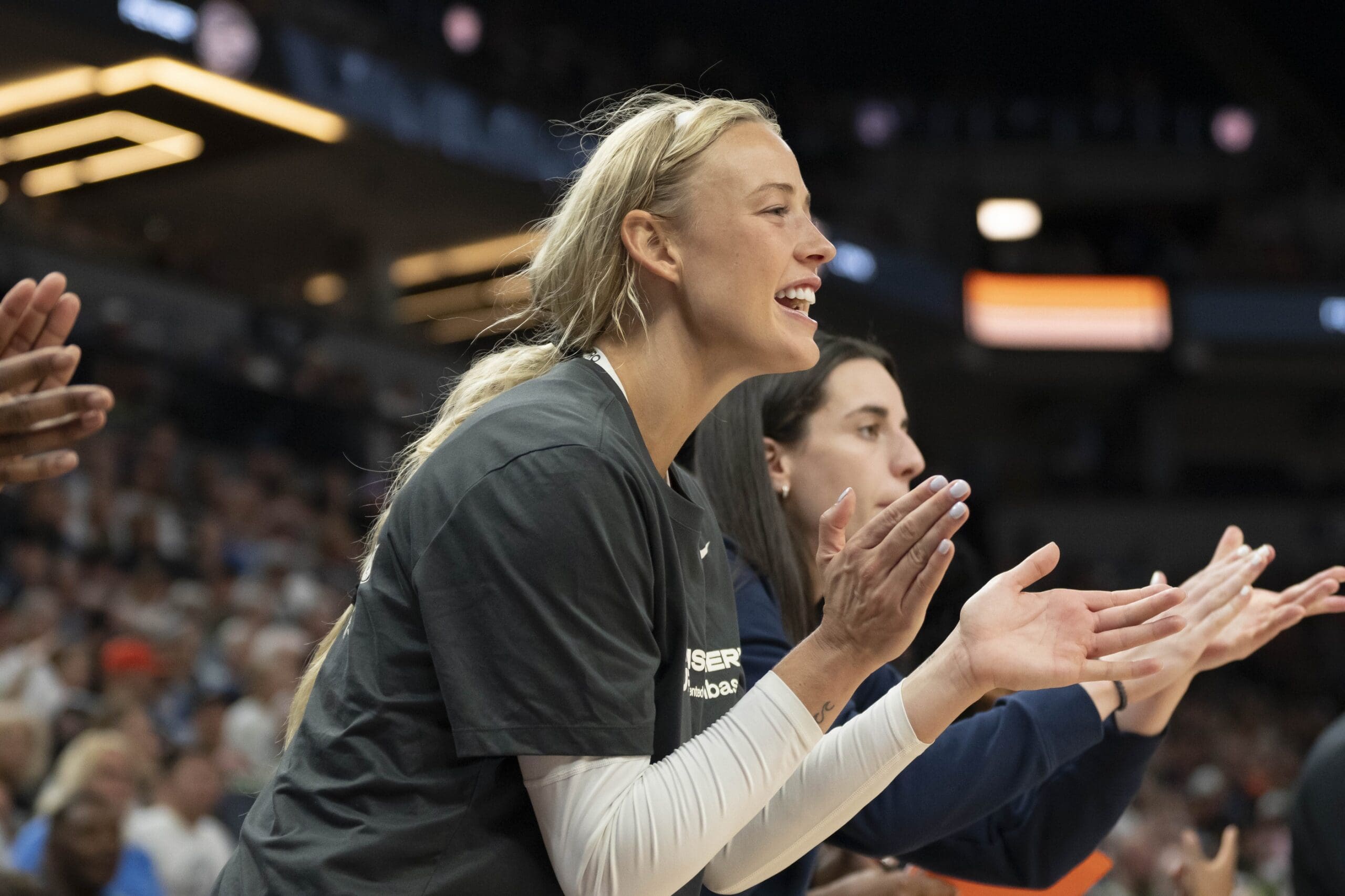 Jul 1, 2025; Minneapolis, Minnesota, USA; Indiana Fever guard Sophie Cunningham (8) celebrates a shot made from her teammates against the Minnesota Lynx in the second half during the Commissioner's Cup final at Target Center. Mandatory Credit: Jesse Johnson-Imagn Images