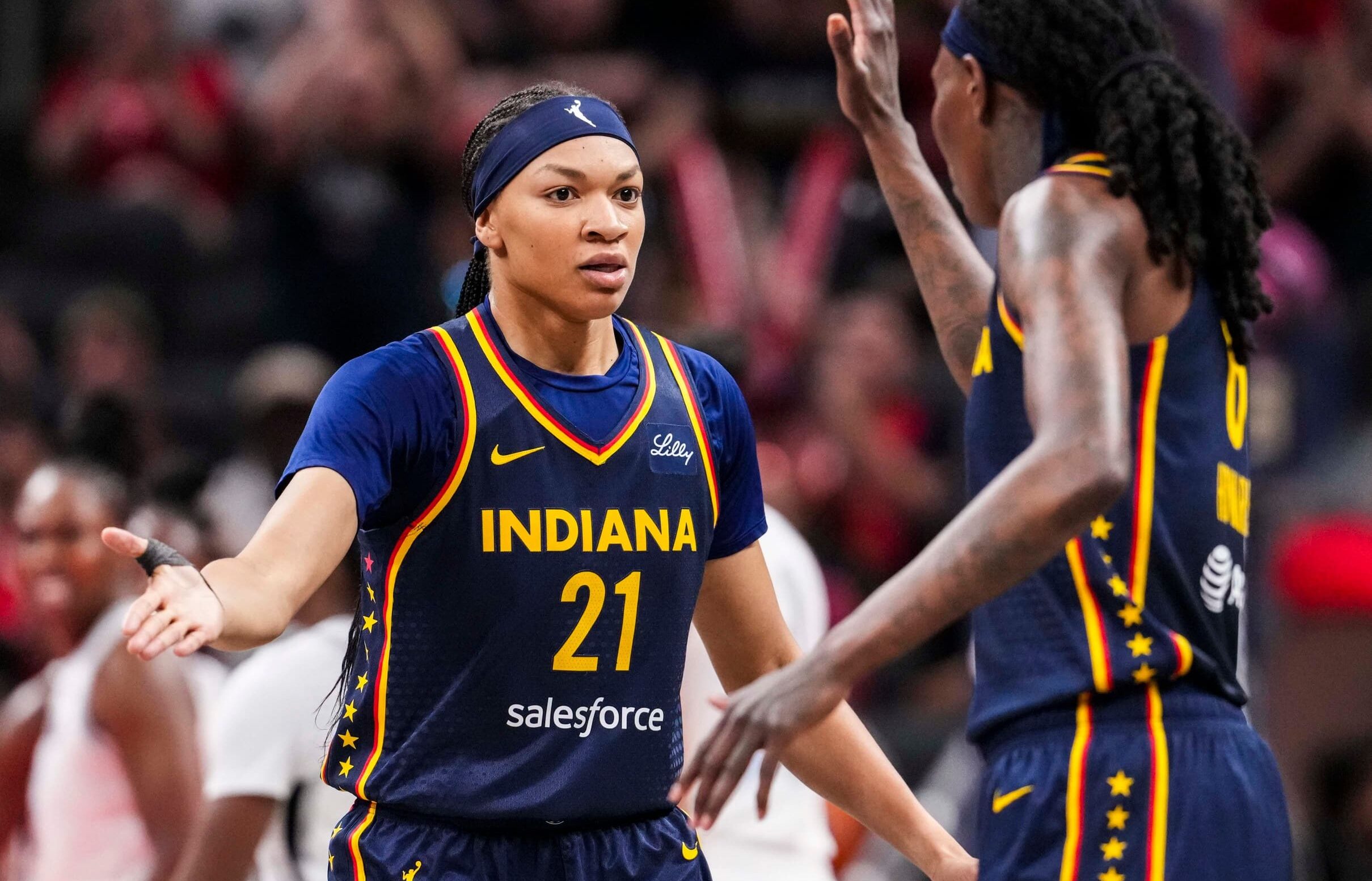 Indiana Fever forward Makayla Timpson (21) and Indiana Fever forward Natasha Howard (6) high five Thursday, July 3, 2025, during a game between the Indiana Fever and the Las Vegas Aces at Gainbridge Fieldhouse in Indianapolis.
