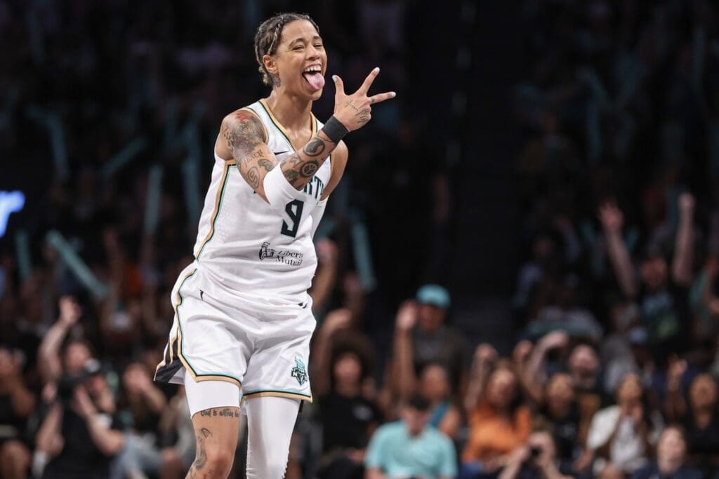 Jul 3, 2025; Brooklyn, New York, USA; New York Liberty guard Natasha Cloud (9) celebrates after making a three point shot in the third quarter against the Los Angeles Sparks at Barclays Center. Mandatory Credit: Wendell Cruz-Imagn Images