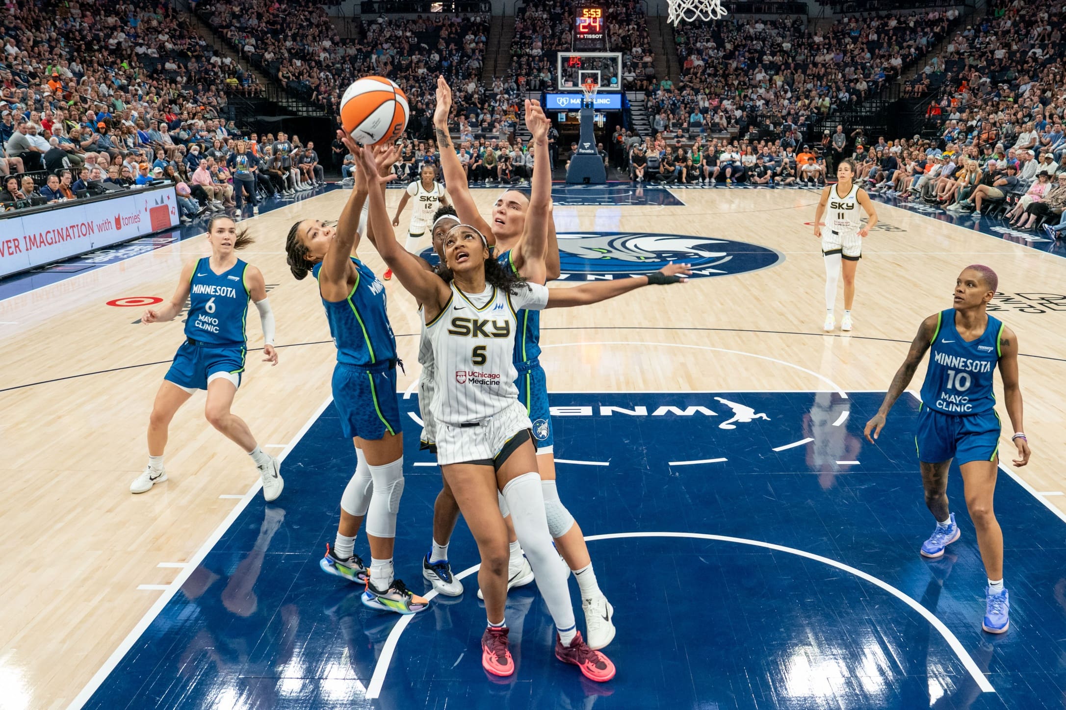 Jul 6, 2025; Minneapolis, Minnesota, USA; Chicago Sky forward Angel Reese (5) comes down with the rebound in a pack of Minnesota Lynx players in the fourth quarter at Target Center. Mandatory Credit: Matt Blewett-Imagn Images