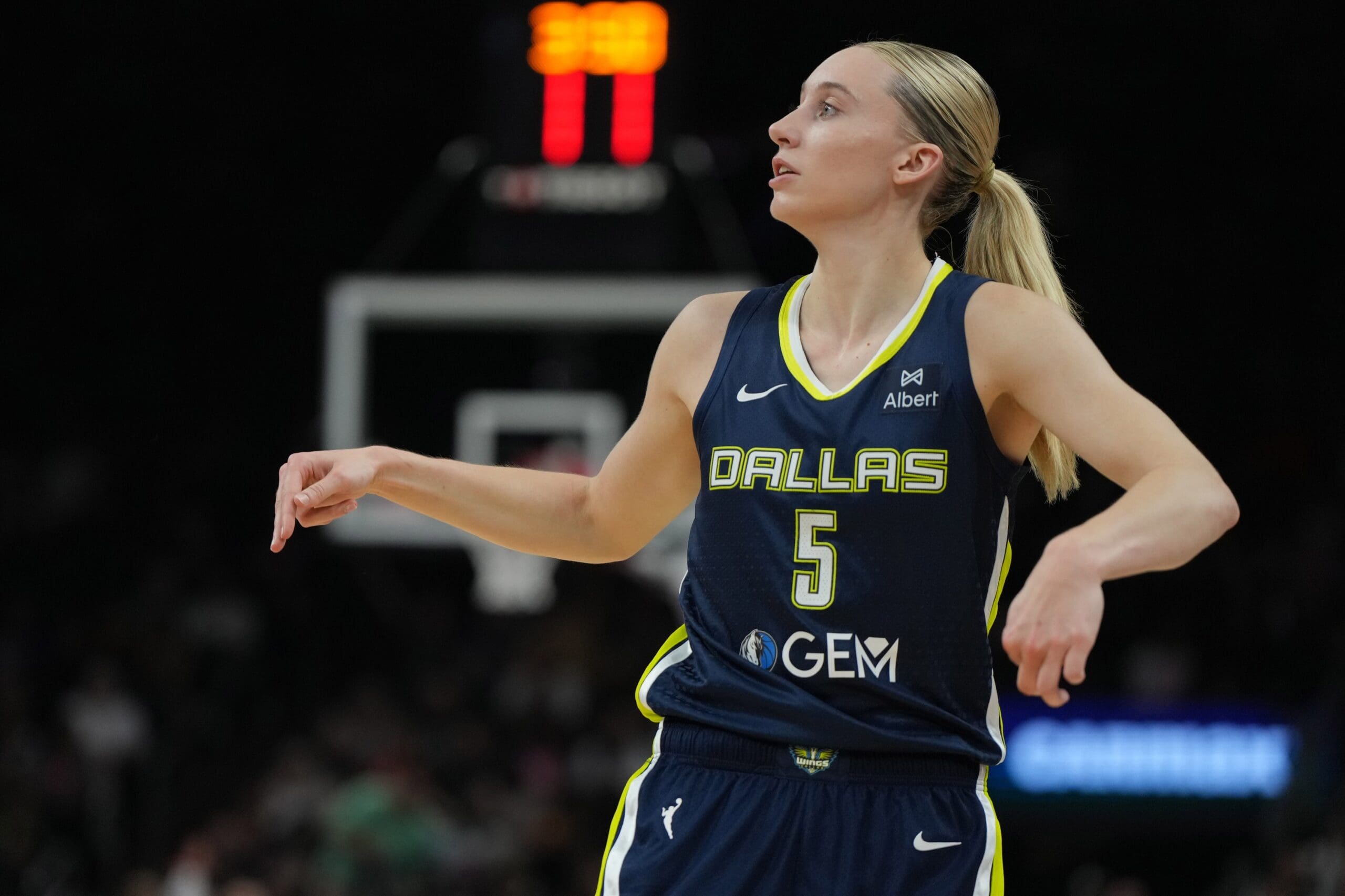 Jul 7, 2025; Phoenix, Arizona, USA; Dallas Wings guard Paige Bueckers (5) shoots against the Phoenix Mercury in the first half at Footprint Center. Mandatory Credit: Rick Scuteri-Imagn Images