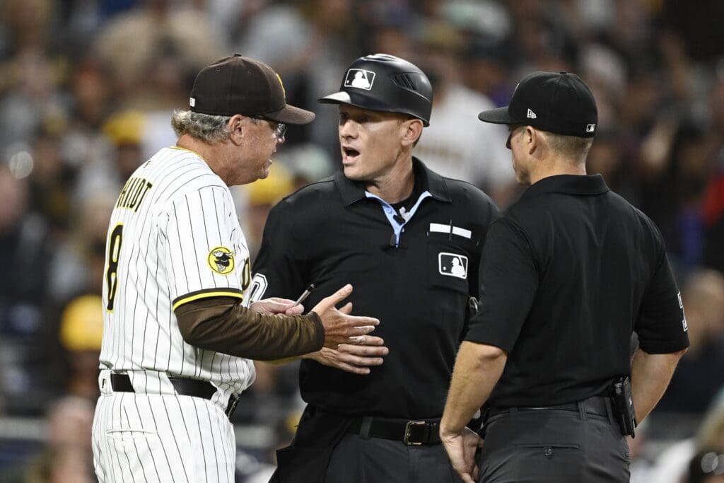 Jul 8, 2025; San Diego, California, USA; San Diego Padres manager Mike Shildt (8) argues a call with umpires Brian Walsh (60), center, and Tripp Gibson during the sixth inning against the Arizona Diamondbacks at Petco Park. Mandatory Credit: Denis Poroy-Imagn Images