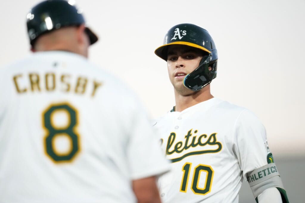 Jul 9, 2025; West Sacramento, California, USA; Athletics shortstop Max Muncy (10) stands on first base after hitting a single against the Atlanta Braves in the sixth inning at Sutter Health Park. Mandatory Credit: Cary Edmondson-Imagn Images