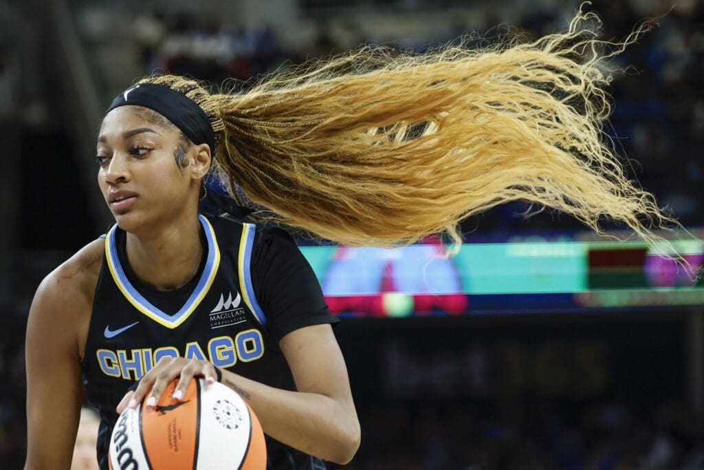 Jul 9, 2025; Chicago, Illinois, USA; Chicago Sky forward Angel Reese (5) drives to the basket against the Dallas Wings during the second half of a WNBA game at Wintrust Arena. Mandatory Credit: Kamil Krzaczynski-Imagn Images