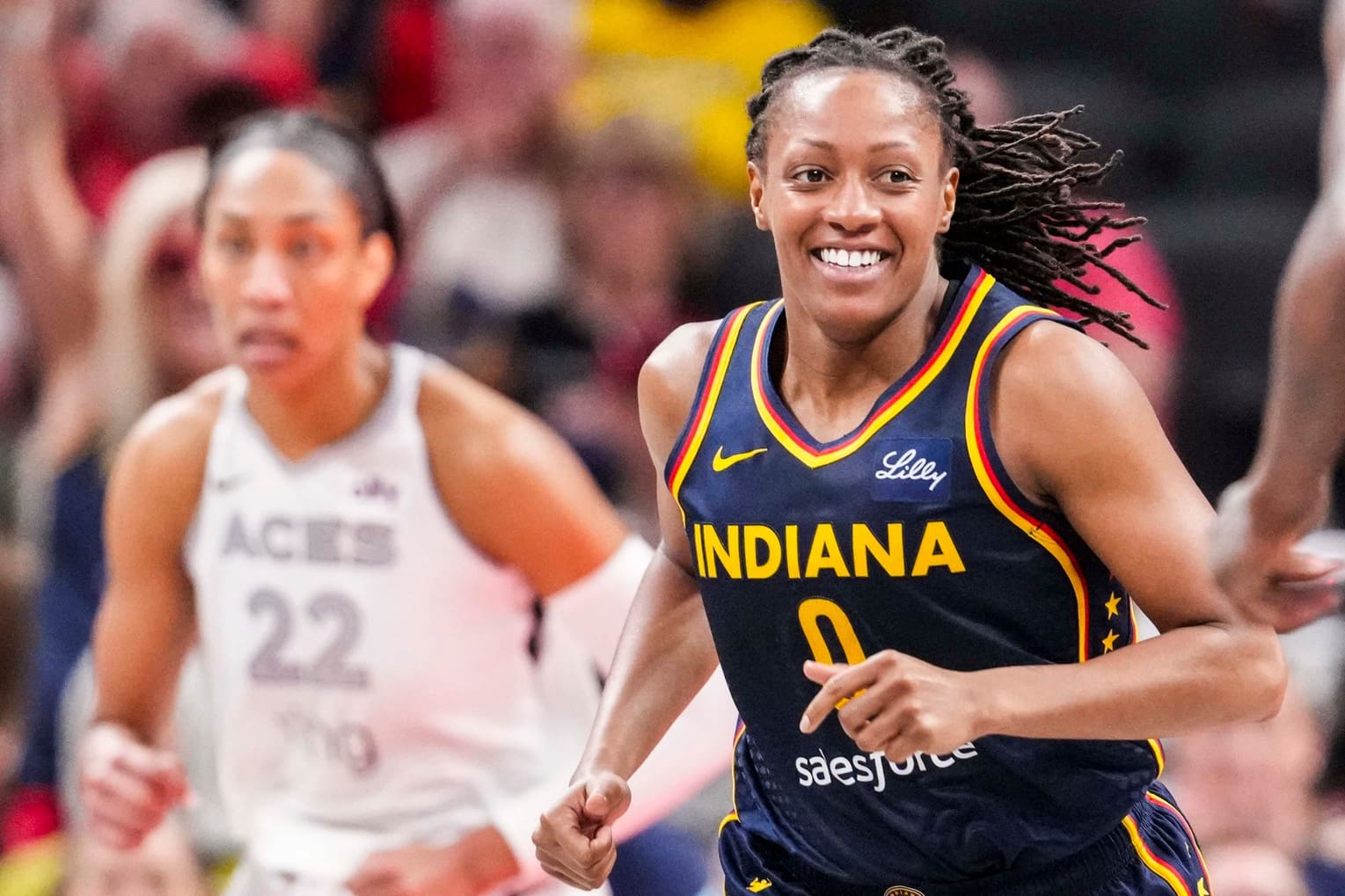 Indiana Fever guard Kelsey Mitchell (0) smiles after a play Thursday, July 3, 2025, during a game between the Indiana Fever and the Las Vegas Aces at Gainbridge Fieldhouse in Indianapolis.