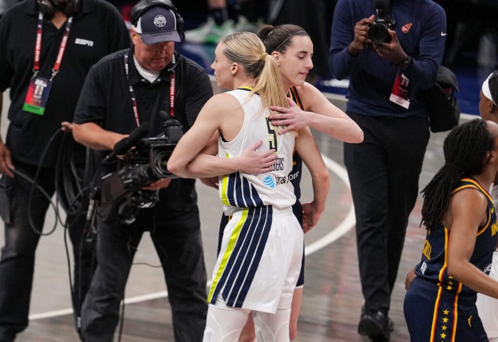 Indiana Fever guard Caitlin Clark (22) and Dallas Wings guard Paige Bueckers (5) hug Sunday, July 13, 2025, ahead of the game at Gainbridge Fieldhouse in Indianapolis.