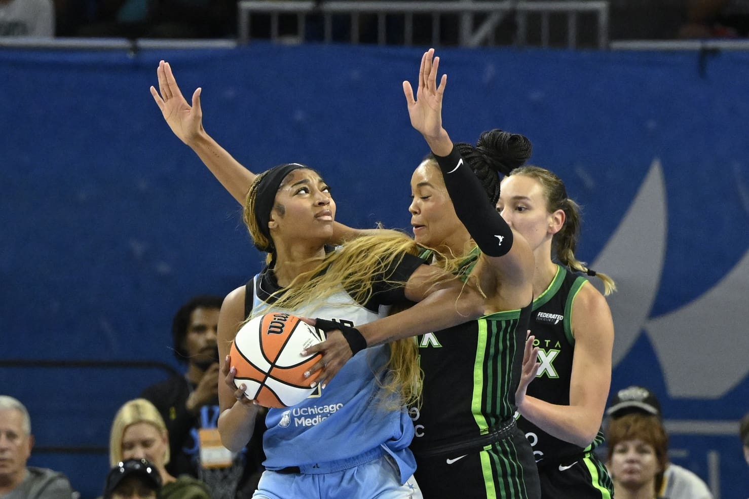 Jul 14, 2025; Chicago, Illinois, USA; Chicago Sky forward Angel Reese (5) drives to the basket against Minnesota Lynx forward Alanna Smith (8) and forward Napheesa Collier (24) defends against Minnesota Lynx forward Jessica Shepard (15) during the first half at Wintrust Arena. Mandatory Credit: Matt Marton-Imagn Images