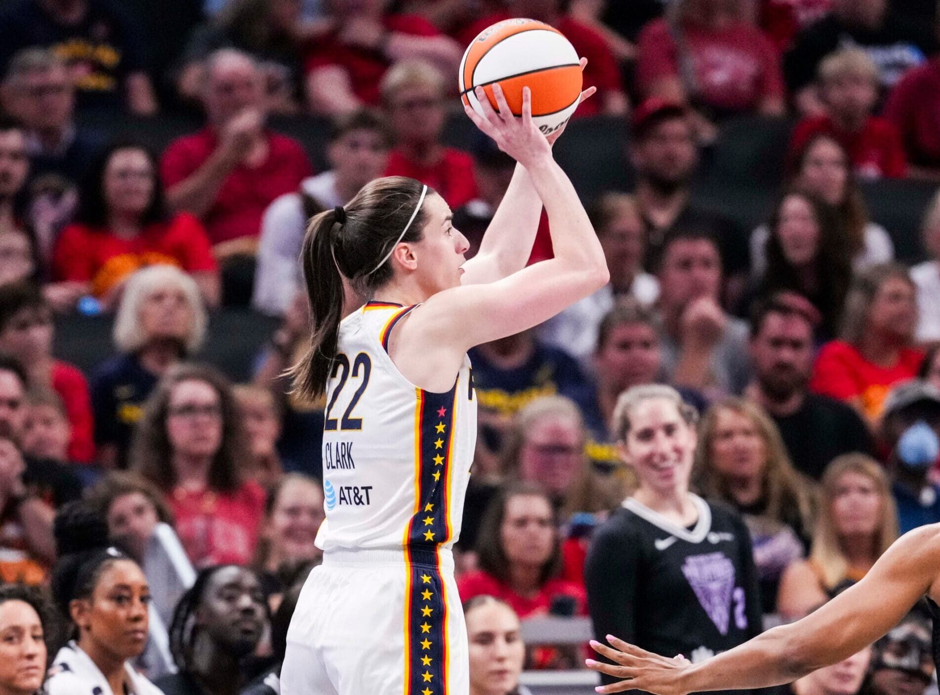 Indiana Fever guard Caitlin Clark (22) attempts a 3-pointer against Golden State Valkyries forward Kayla Thornton (5) on Wednesday, July 9, 2025, during a game between the Indiana Fever and the Golden State Valkyries at Gainbridge Fieldhouse in Indianapolis.