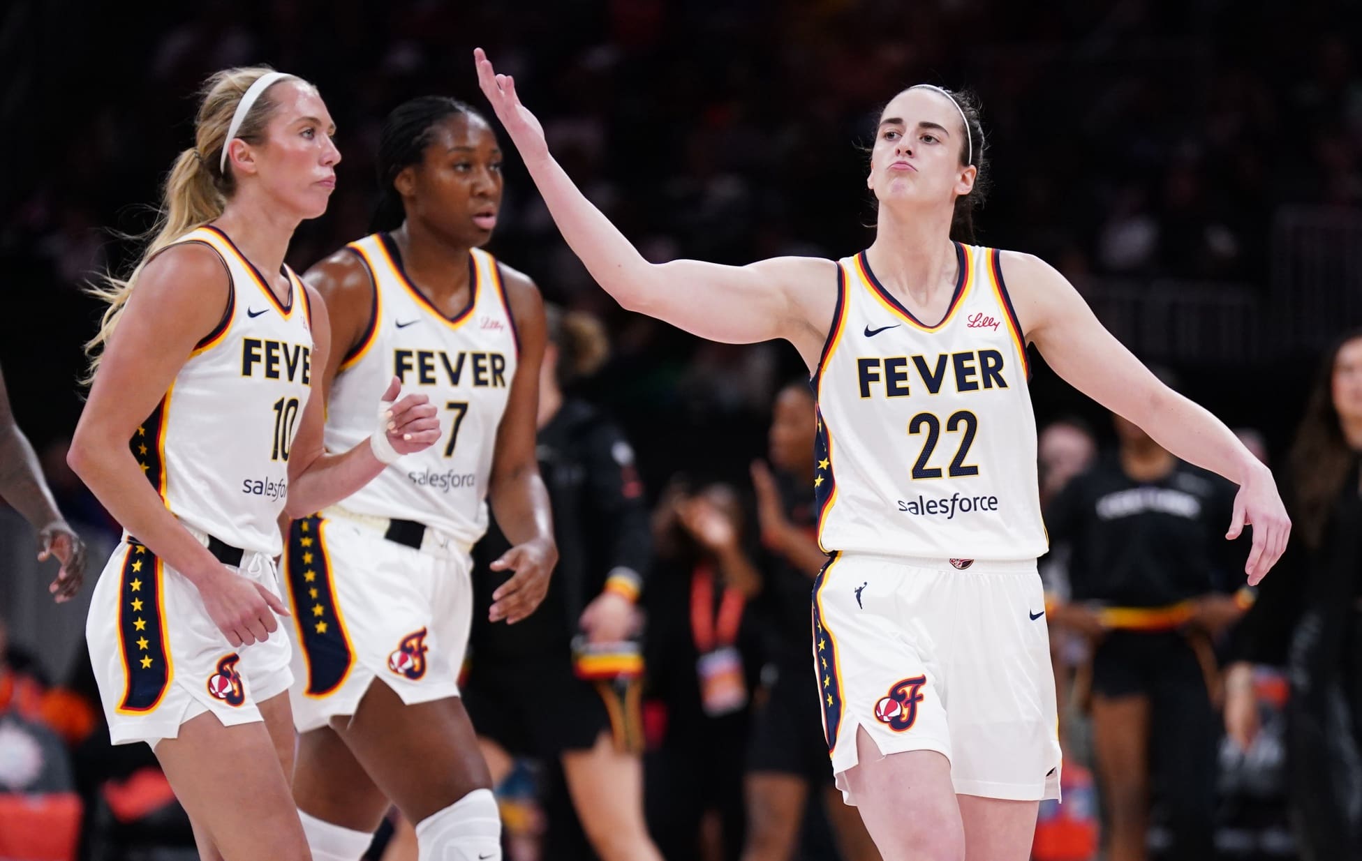 Jul 15, 2025; Boston, Massachusetts, USA; Indiana Fever guard Caitlin Clark (22) reacts to the crowd as they take on the Connecticut Sun in the first quarter at TD Garden. Mandatory Credit: David Butler II-Imagn Images