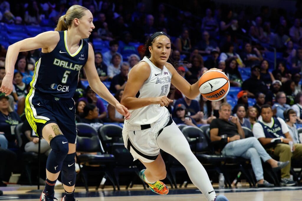 Jul 16, 2025; Arlington, Texas, USA; Las Vegas Aces guard Aaliyah Nye (13) drives to the basket as Dallas Wings guard Paige Bueckers (5) defends during the first half at College Park Center. Mandatory Credit: Chris Jones-Imagn Images