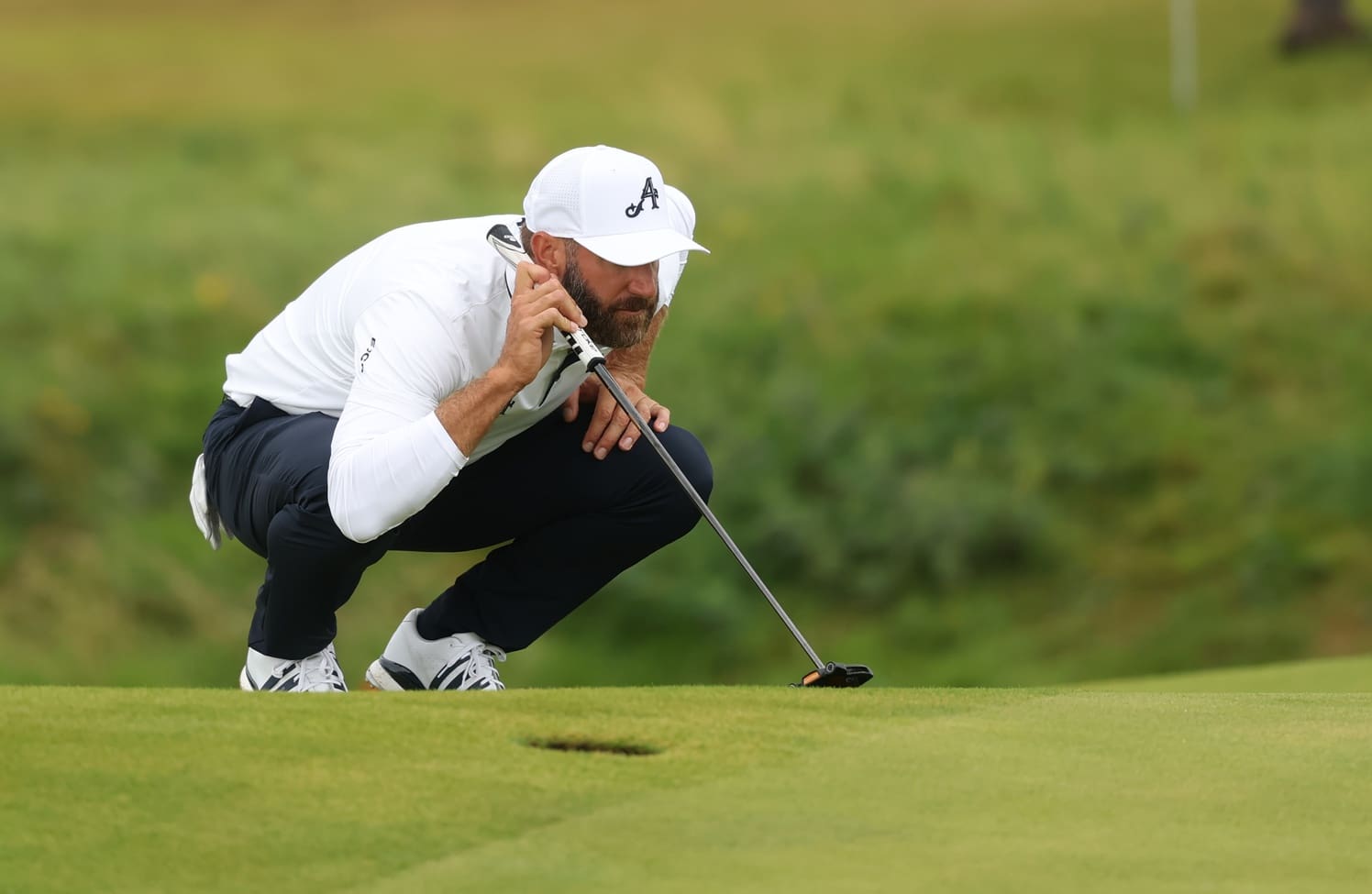 Jul 18, 2025; Portrush, IRL; Dustin Johnson lines up a putt on the seventh hole during the second round of The 153rd Open Championship golf tournament. Mandatory Credit: Mike Frey-Imagn Images