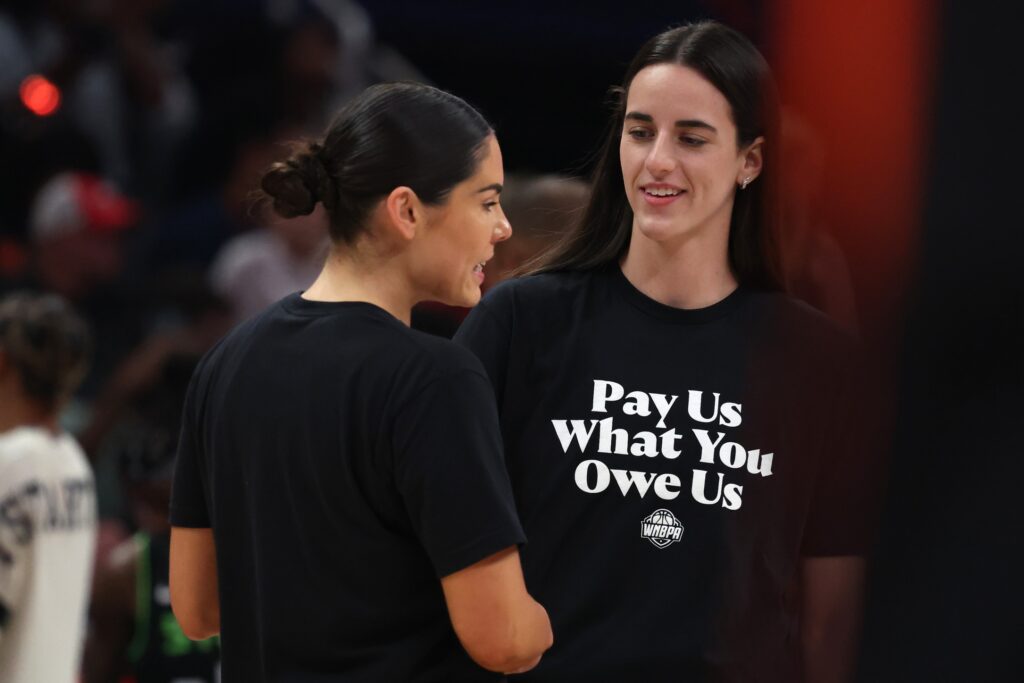 Jul 19, 2025; Indianapolis, IN, USA; Team Clark guard Caitlin Clark (22) and Team Collier guard Kelsey Plum (10) before the 2025 WNBA All Star Game at Gainbridge Fieldhouse. Mandatory Credit: Trevor Ruszkowski-Imagn Images