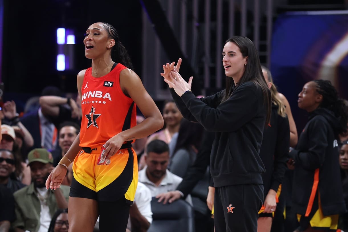 Jul 19, 2025; Indianapolis, IN, USA; Team Clark guard Caitlin Clark (22) and center A'ja Wilson (22) react on the bench in the fourth quarter against Team Collier the 2025 WNBA All Star Game at Gainbridge Fieldhouse. Mandatory Credit: Trevor Ruszkowski-Imagn Images