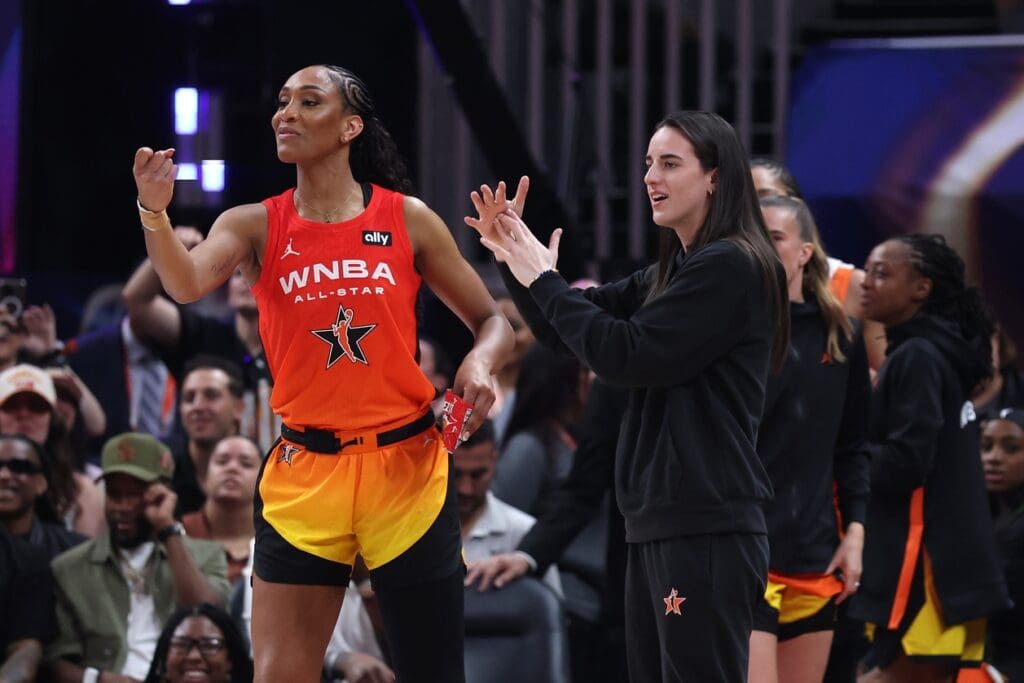 Jul 19, 2025; Indianapolis, IN, USA; Team Clark guard Caitlin Clark (22) and center A'ja Wilson (22) react on the bench in the fourth quarter against Team Collier the 2025 WNBA All Star Game at Gainbridge Fieldhouse. Mandatory Credit: Trevor Ruszkowski-Imagn Images