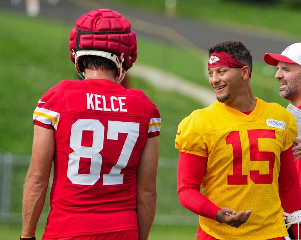 Jul 22, 2025; St. Joseph, MO, USA; Kansas City Chiefs quarterback Patrick Mahomes (15) laughs with tight end Travis Kelce (87) during training camp at Missouri Western State University.