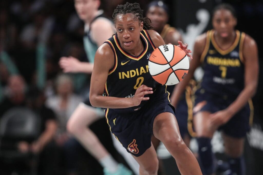 Jul 22, 2025; Brooklyn, New York, USA; Indiana Fever guard Kelsey Mitchell (0) brings the ball up court in the third quarter against the New York Liberty at Barclays Center. Mandatory Credit: Wendell Cruz-Imagn Images