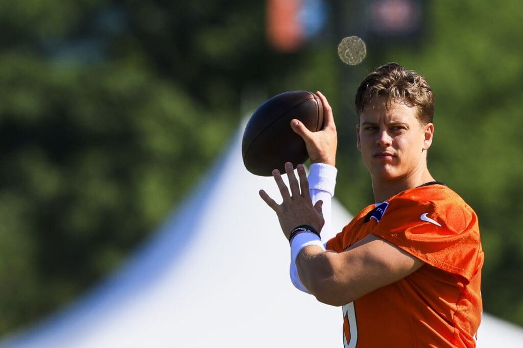 Jul 23, 2025; Cincinnati, OH, USA; Cincinnati Bengals quarterback Joe Burrow (9) throws a pass during training camp at Kettering Health Practice Field. Mandatory Credit: Katie Stratman-Imagn Images