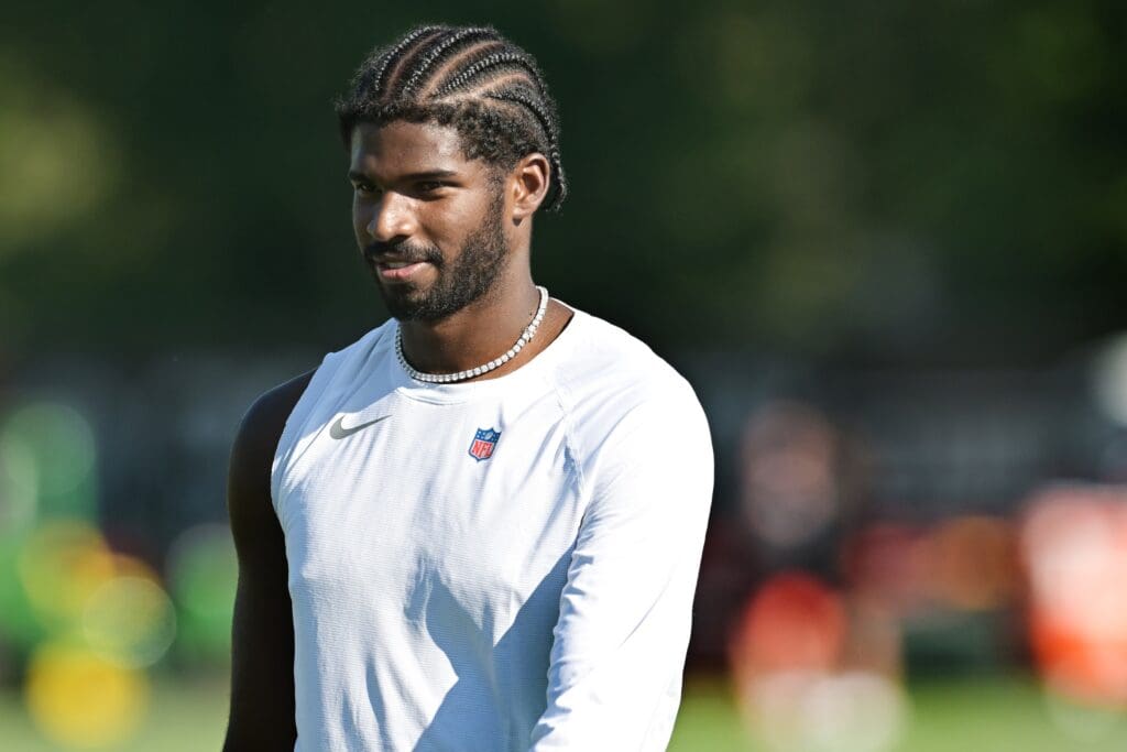 Jul 23, 2025; Berea, OH, USA; Cleveland Browns quarterback Shedeur Sanders (12) walks off the field during training camp at CrossCountry Mortgage Campus. Mandatory Credit: Ken Blaze-Imagn Images