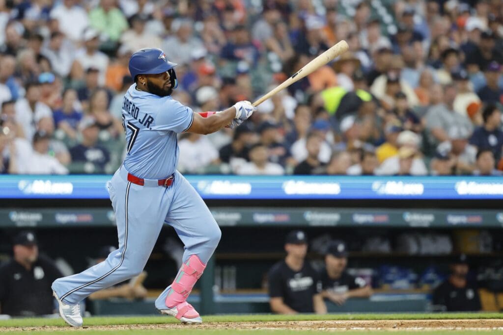 Jul 24, 2025; Detroit, Michigan, USA; Toronto Blue Jays first baseman Vladimir Guerrero Jr. (27) hits an rbi-single in the seventh inning against the Detroit Tigers at Comerica Park. Mandatory Credit: Rick Osentoski-Imagn Images