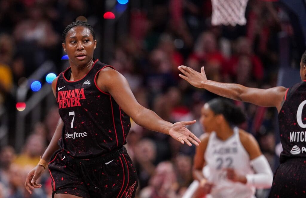 Indiana Fever forward Aliyah Boston (7) high-fives Indiana Fever guard Kelsey Mitchell (0) on Thursday, July 24, 2025, during the game at Gainbridge Fieldhouse in Indianapolis.
