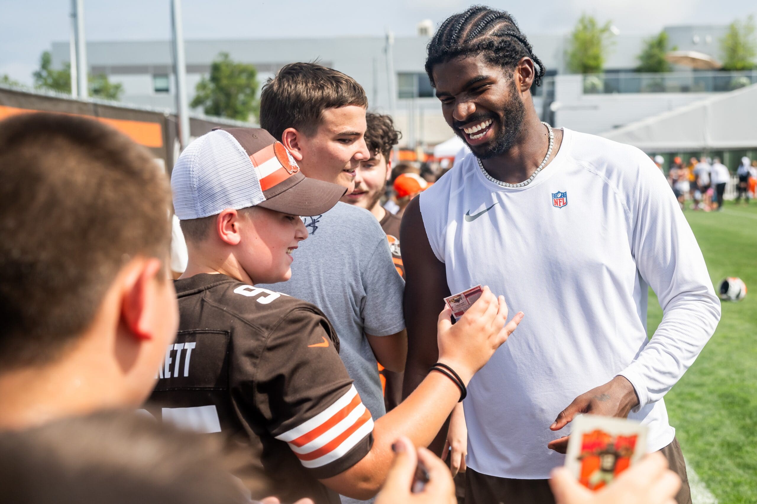 Jul 26, 2025; Berea, OH, USA; Cleveland Browns quarterback Shedeur Sanders (12) talks to a fan during training camp at CrossCountry Mortgage Campus. Mandatory Credit: Ken Blaze-Imagn Images