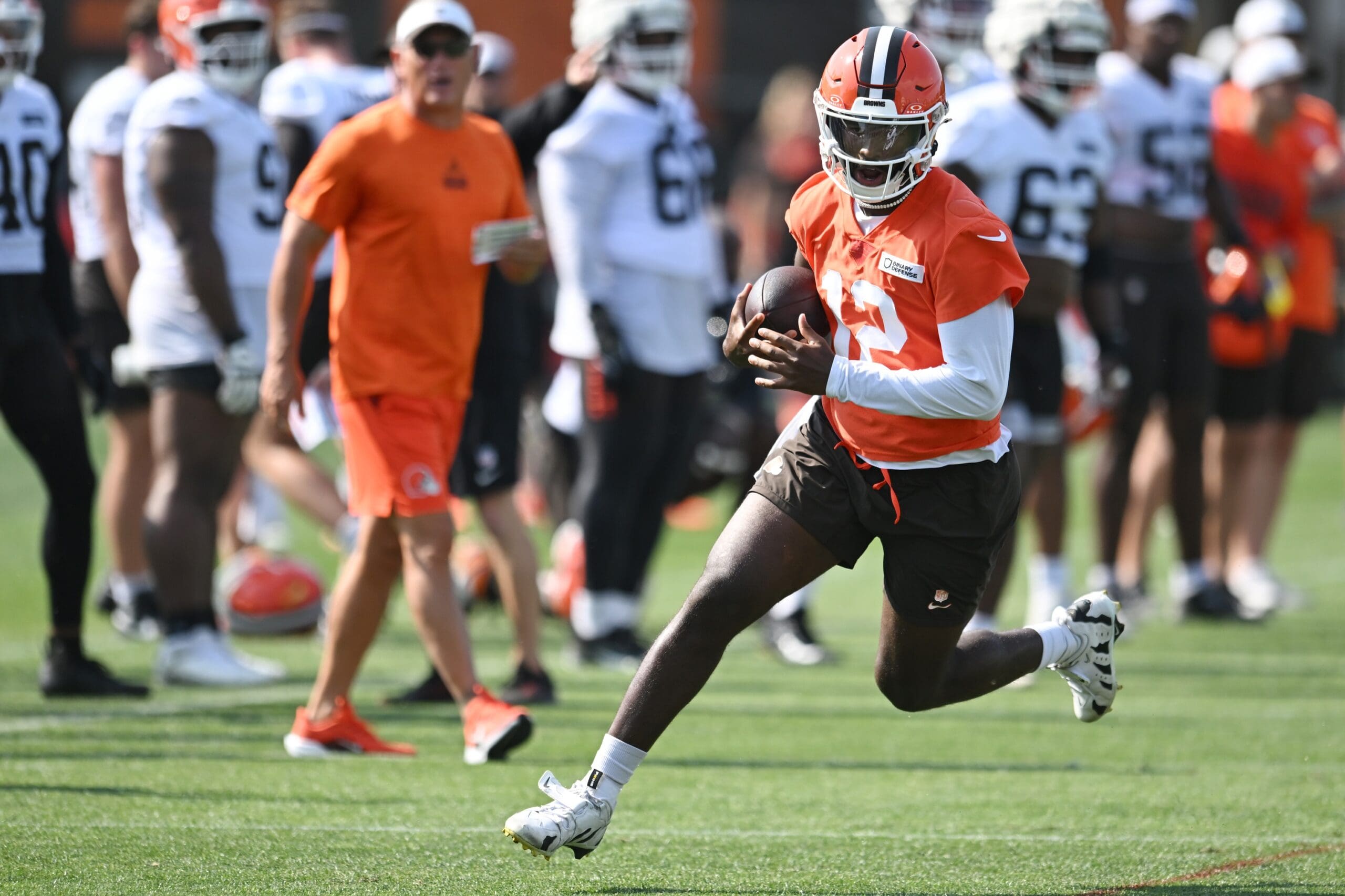 Jul 26, 2025; Berea, OH, USA; Cleveland Browns quarterback Shedeur Sanders (12) scrambles during training camp at CrossCountry Mortgage Campus. Mandatory Credit: Ken Blaze-Imagn Images
