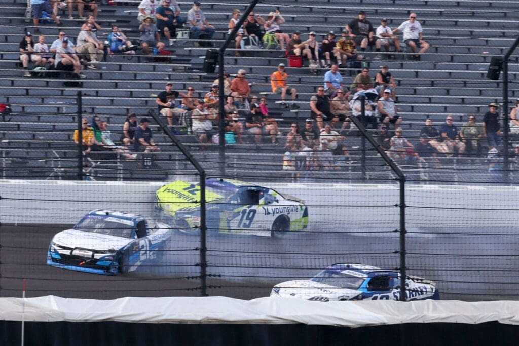 NASCAR Xfinity Series driver Austin Hill (21) and NASCAR Xfinity Series driver Aric Almirola (19) collide Saturday, July 26, 2025, during the Pennzoil 250 at Indianapolis Motor Speedway.