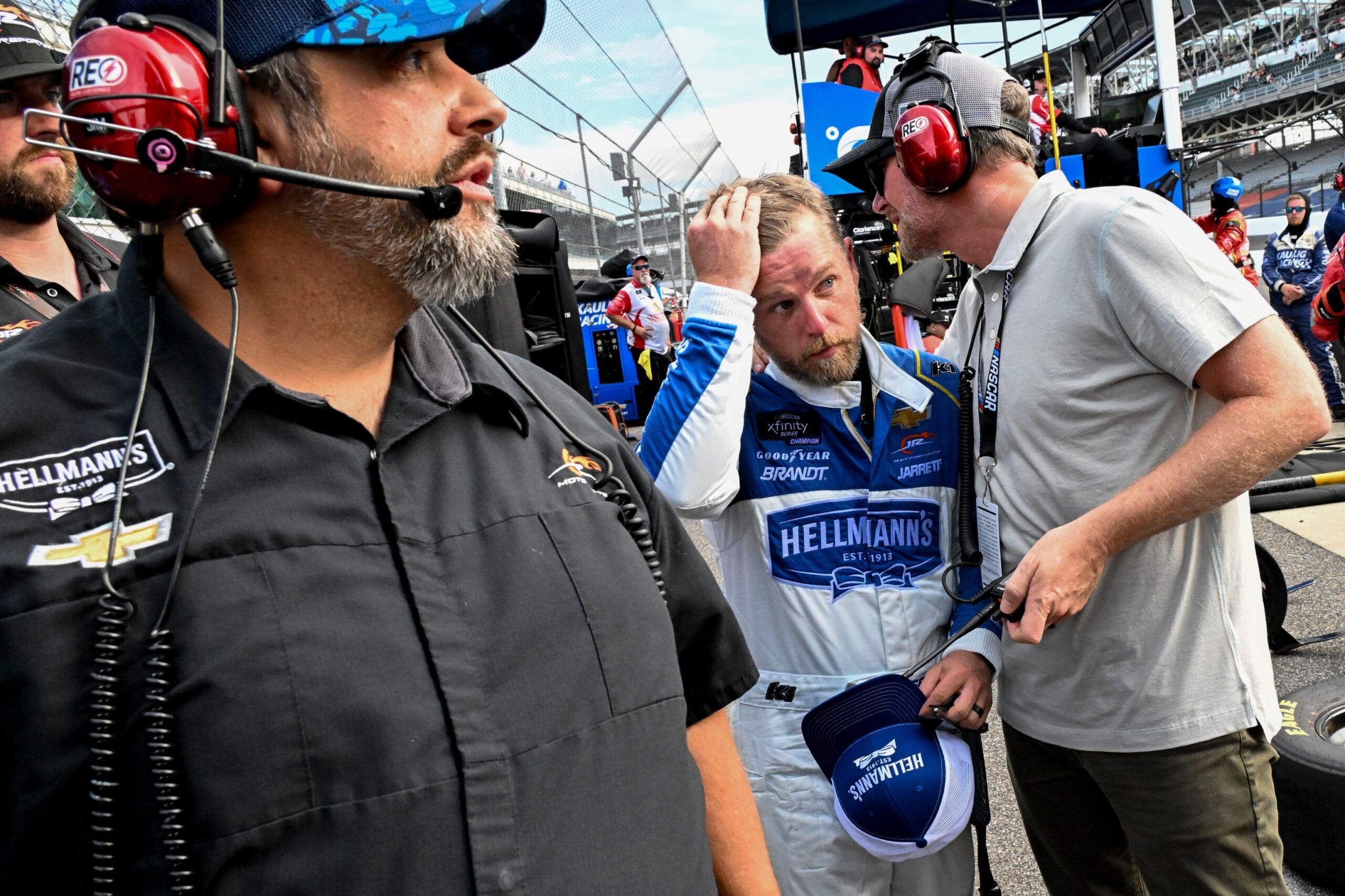 Dale Earnhardt Jr. talks with NASCAR Xfinity Series driver Justin Allgaier (7) after a collision took him out of the race Saturday, July 26, 2025, during the Pennzoil 250 at Indianapolis Motor Speedway.