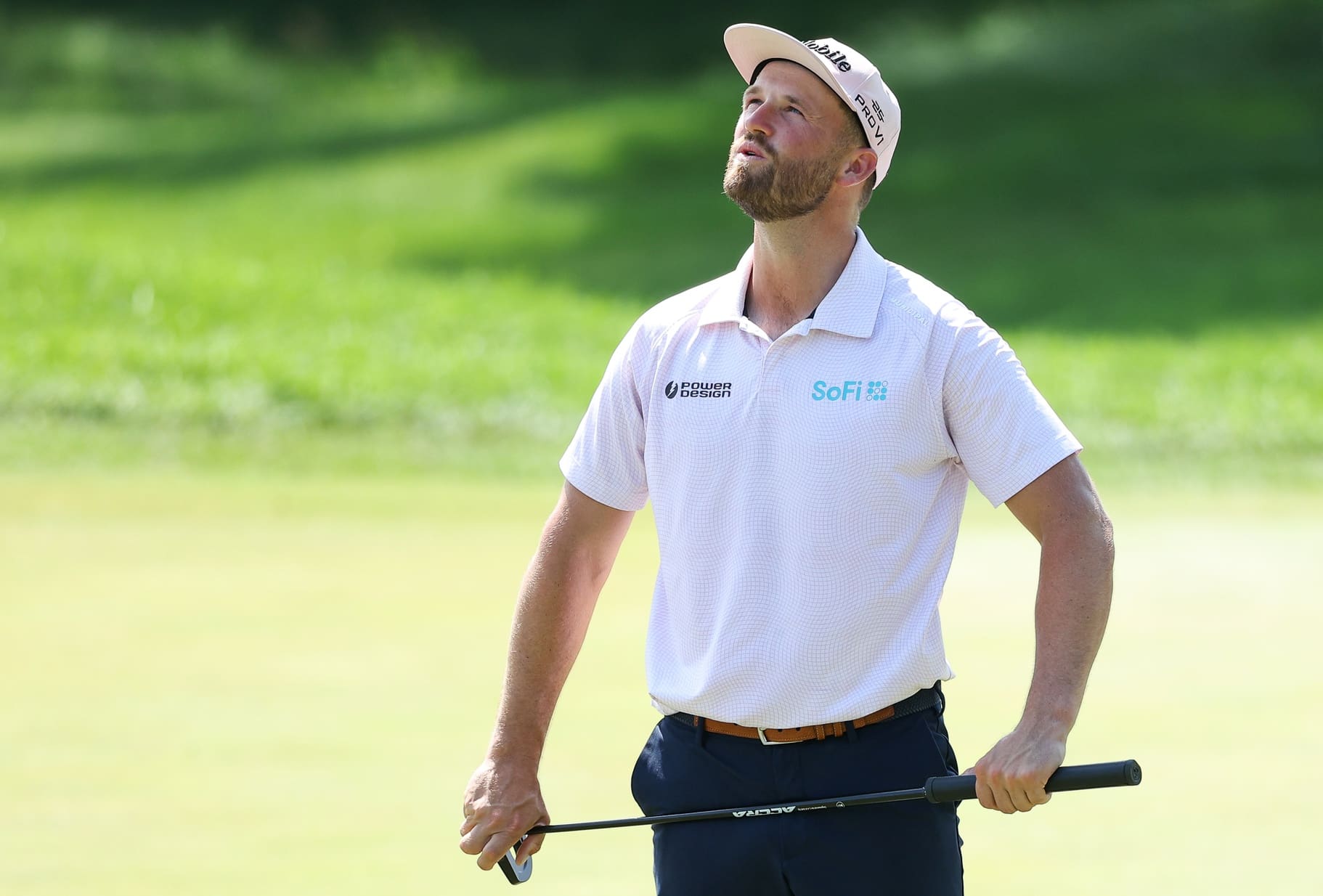 Jul 27, 2025; Blaine, Minnesota, USA; Wyndham Clark reacts to his putt on the first green during the final round of the 3M Open golf tournament. Mandatory Credit: Matt Krohn-Imagn Images
